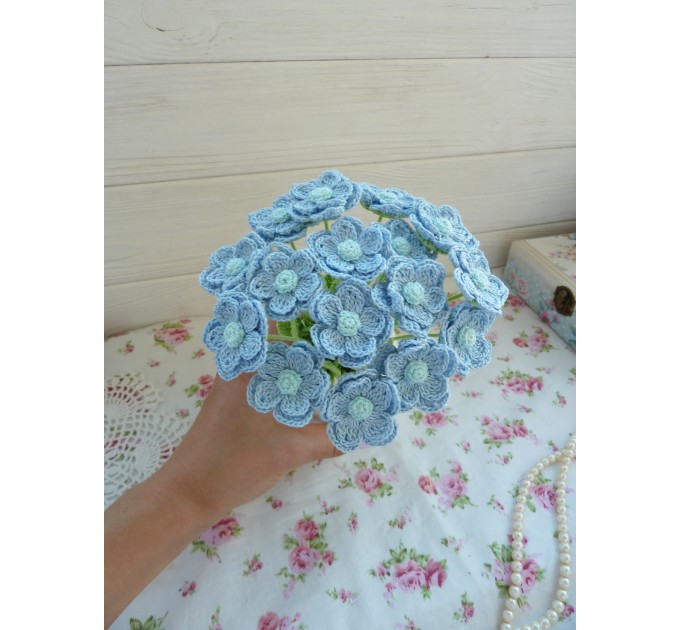 Crochet bouquet of blue flowers.