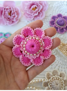 Crochet flower with pearls.