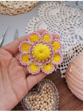 Crochet flower with pearls.