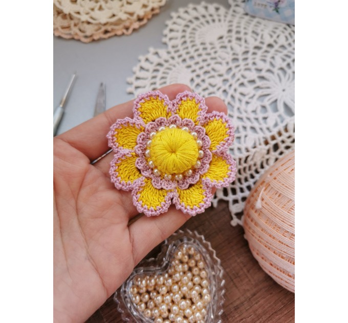 Crochet flower with pearls.