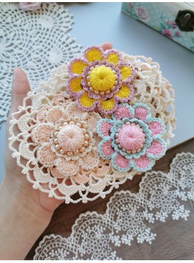 Crochet flower with pearls.