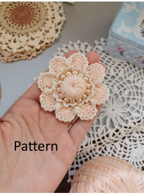 Crochet flower with pearls.